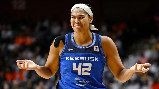Sun center Brionna Jones shrugging